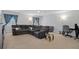 Bonus room with sectional sofa and workspace at 19301 Sandy Springs Cir, Lutz, FL 33558