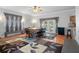 Bright dining room features a large table, access to patio, and pool view at 19301 Sandy Springs Cir, Lutz, FL 33558