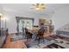 Dining area with a large table and access to the pool and patio at 19301 Sandy Springs Cir, Lutz, FL 33558