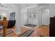 Elegant entryway with double doors, hardwood floors, and access to living area at 19301 Sandy Springs Cir, Lutz, FL 33558