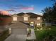 Two-story house with a large yard, double garage, and walkway at 19301 Sandy Springs Cir, Lutz, FL 33558