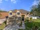 Two-story house with a large yard, double garage, and walkway at 19301 Sandy Springs Cir, Lutz, FL 33558