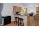 Kitchen features a breakfast bar with granite countertop and two stools at 19301 Sandy Springs Cir, Lutz, FL 33558