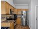 Kitchen boasts stainless steel appliances and granite countertops at 19301 Sandy Springs Cir, Lutz, FL 33558