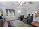 Spacious living room with hardwood floors, large windows, and comfortable seating at 19301 Sandy Springs Cir, Lutz, FL 33558