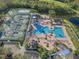 Resort-style pool, tennis courts, and lounge area at 19301 Sandy Springs Cir, Lutz, FL 33558