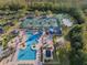 Aerial view of community pool, tennis courts, and playground at 19301 Sandy Springs Cir, Lutz, FL 33558