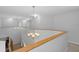 Upstairs hallway with two light fixtures at 19301 Sandy Springs Cir, Lutz, FL 33558