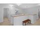 Upstairs hallway with wood railing and bench at 19301 Sandy Springs Cir, Lutz, FL 33558