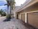 Exterior view of home with two-car garage and brick driveway at 4010 Belle Vista Dr, St Pete Beach, FL 33706