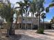 Two-story home with a paver driveway and lush landscaping at 4010 Belle Vista Dr, St Pete Beach, FL 33706