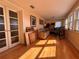 Sun-filled room with wood floors, a couch, and exercise bike at 4010 Belle Vista Dr, St Pete Beach, FL 33706