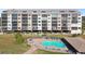 Building exterior with pool and patio area at 4650 Bay Blvd # 1046, Port Richey, FL 34668