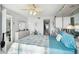 Bright bedroom with a queen bed, dresser, and access to a bathroom at 4650 Bay Blvd # 1046, Port Richey, FL 34668