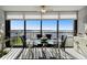 Dining room with glass table and chairs, boasting stunning water views at 4650 Bay Blvd # 1046, Port Richey, FL 34668