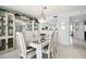 Spacious dining area with a white table and built-in hutch at 4650 Bay Blvd # 1046, Port Richey, FL 34668