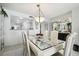 Elegant dining room featuring a white table and matching chairs at 4650 Bay Blvd # 1046, Port Richey, FL 34668