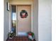 Inviting condo entry with festive holiday wreath at 4650 Bay Blvd # 1046, Port Richey, FL 34668