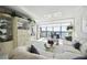 Sunlit living room with sectional sofa and water views at 4650 Bay Blvd # 1046, Port Richey, FL 34668