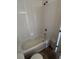 Spacious bathroom with a white bathtub and tiled walls at 6023 Osprey Lake Cir, Riverview, FL 33578