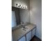Bathroom vanity with a sink, mirror, and light fixture at 6023 Osprey Lake Cir, Riverview, FL 33578