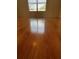 Wood-look laminate floors and window in empty bedroom at 6023 Osprey Lake Cir, Riverview, FL 33578
