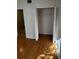 Bedroom with wood laminate flooring and a closet with double doors at 6023 Osprey Lake Cir, Riverview, FL 33578