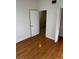 Empty bedroom with wood-look flooring and white walls at 6023 Osprey Lake Cir, Riverview, FL 33578