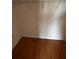 Empty walk-in closet with wire shelving and wood-look laminate floors at 6023 Osprey Lake Cir, Riverview, FL 33578