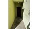 The front entryway features a dark wood door and neutral concrete flooring at 6023 Osprey Lake Cir, Riverview, FL 33578
