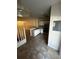 The kitchen features white cabinets, stainless steel appliances, and tile flooring at 6023 Osprey Lake Cir, Riverview, FL 33578