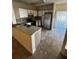 Kitchen with white cabinets, stainless steel appliances, and tile flooring at 6023 Osprey Lake Cir, Riverview, FL 33578