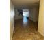Open-concept living room and kitchen area with tile floors at 6023 Osprey Lake Cir, Riverview, FL 33578