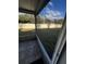 Screened porch with tile flooring and a view of the backyard at 6023 Osprey Lake Cir, Riverview, FL 33578