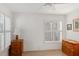 Bright bedroom with wood furniture and window shutters at 6030 51St S St, St Petersburg, FL 33715