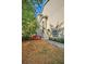 Small backyard with red deck and tropical plants at 609 S Glen Ave # B, Tampa, FL 33609