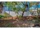 Landscaped backyard with a white fence at 609 S Glen Ave # B, Tampa, FL 33609