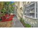 Small backyard with red deck and tropical plants at 609 S Glen Ave # B, Tampa, FL 33609