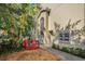 Small backyard with red deck and tropical plants at 609 S Glen Ave # B, Tampa, FL 33609