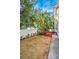Backyard with grass, trees, and a small deck at 609 S Glen Ave # B, Tampa, FL 33609