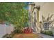 Small backyard with red deck and tropical plants at 609 S Glen Ave # B, Tampa, FL 33609