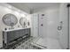 Modern bathroom with double vanity and a large shower at 609 S Glen Ave # B, Tampa, FL 33609