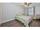 Guest bedroom with full-size bed and wood floors at 609 S Glen Ave # B, Tampa, FL 33609