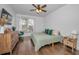 Spacious bedroom with wood floors and large window at 609 S Glen Ave # B, Tampa, FL 33609