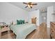 King bedroom with wood floors and access to the bathroom at 609 S Glen Ave # B, Tampa, FL 33609