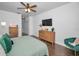 Bright bedroom with a king-size bed and wood floors at 609 S Glen Ave # B, Tampa, FL 33609