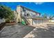 Three-story building with attached garages and outdoor parking at 609 S Glen Ave # B, Tampa, FL 33609