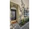 Inviting condo entryway with a black door and landscaping at 609 S Glen Ave # B, Tampa, FL 33609