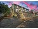 Three-story building with attached garages and outdoor parking at 609 S Glen Ave # B, Tampa, FL 33609