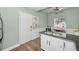 Modern kitchen with white cabinets, granite countertops, and breakfast bar at 609 S Glen Ave # B, Tampa, FL 33609